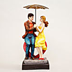 Couple Sitting On Heart Under Umbrella Figurine