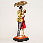 Hugging Couple Under Umbrella Figurine