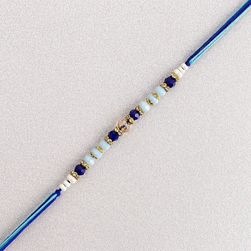 Cerulean Blue Simple Dhaga Rakhi Sweets and Nuts combo