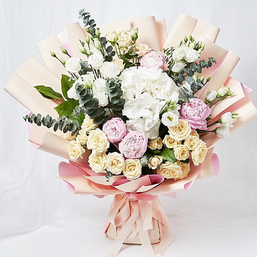 Ravishing Mixed Flowers Wrapped Bouquet:Condolence Flowers to Philippines