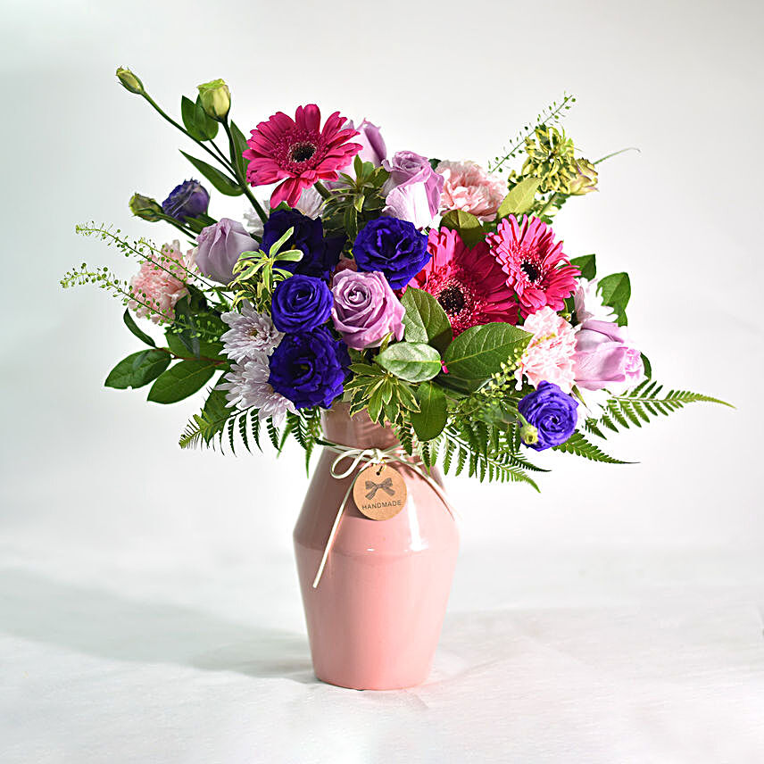 Vibrant Mixed Flowers In Pink Ceramic Vase