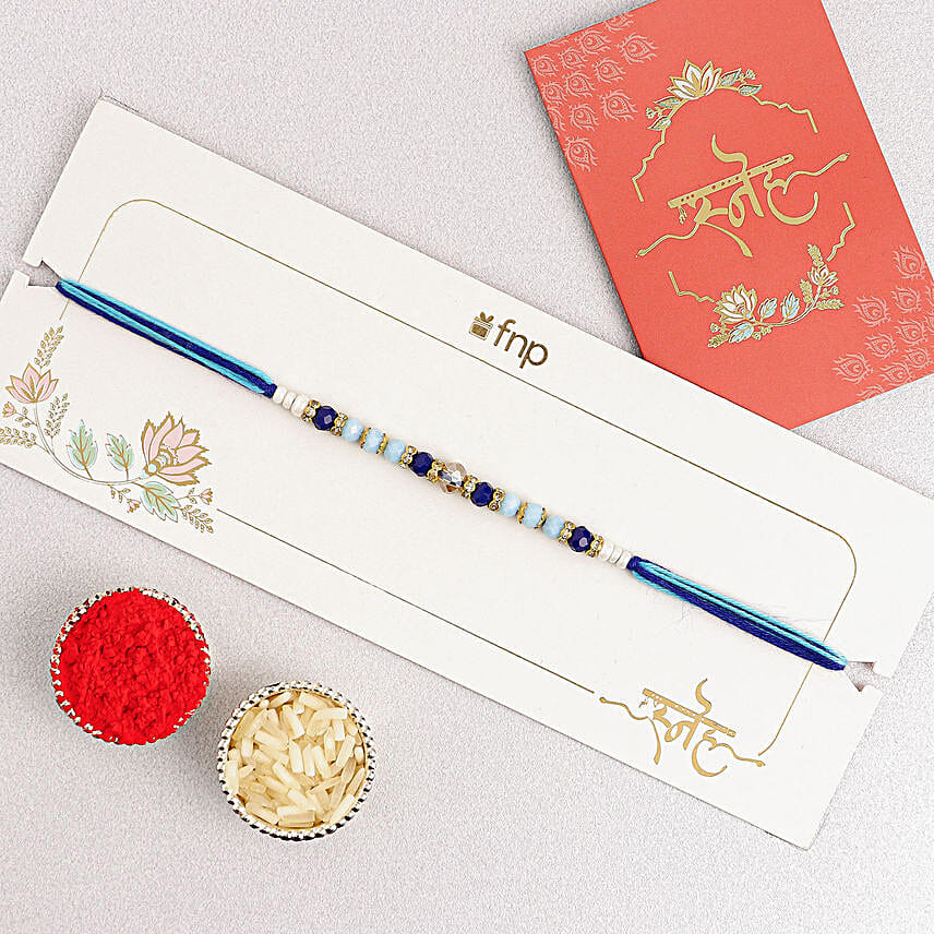 Cerulean Blue Simple Dhaga Rakhi Sweets and Nuts combo