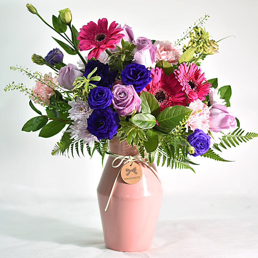 Vibrant Mixed Flowers In Pink Ceramic Vase