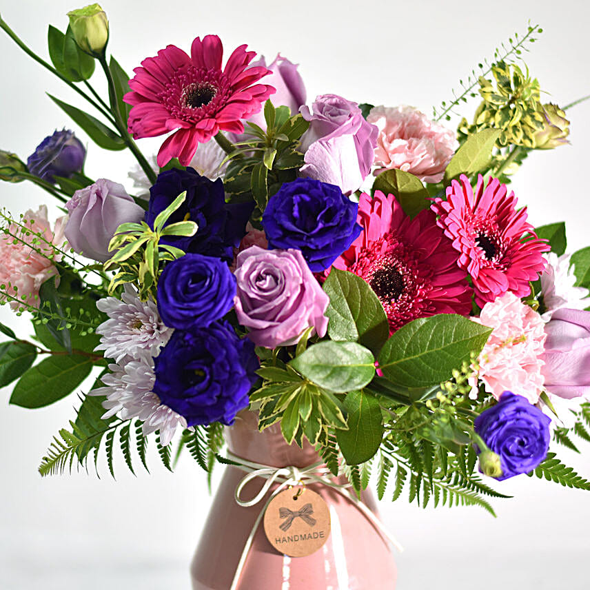 Vibrant Mixed Flowers In Pink Ceramic Vase
