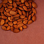 Orange Pearl Lumba Rakhi Set And Bal Krishna Rakhi With 100 Gms Almonds