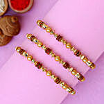 Traditional Pearl Studded Rakhis Set Of 3 With 3 Ferrero Rocher