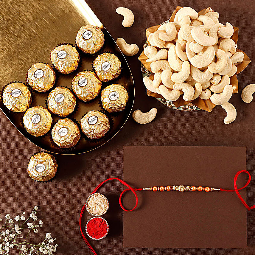 Sneh Rose Gold Rakhi With Cashews & Ferrero Rocher:Rakhi and Chocolates to Qatar