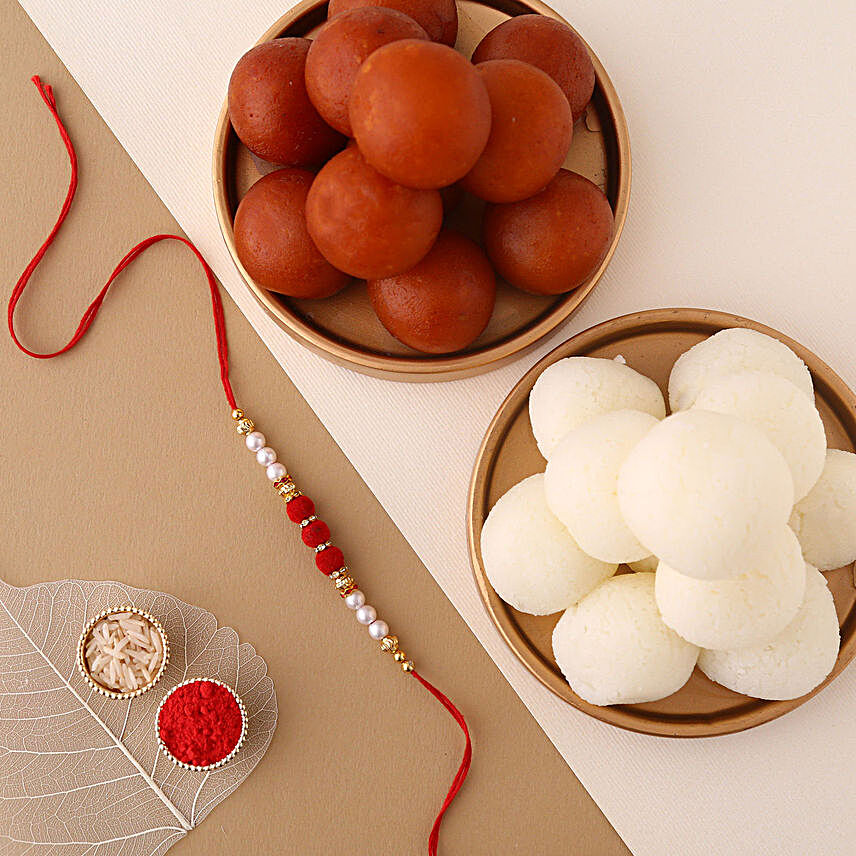 Sneh White Pearls Rakhi & Sweets Tin:Rakhi and Sweets to Qatar