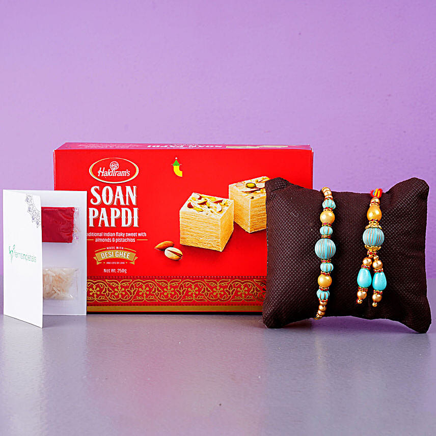Blue Stone Rakhi Set And Soan Papdi Combo