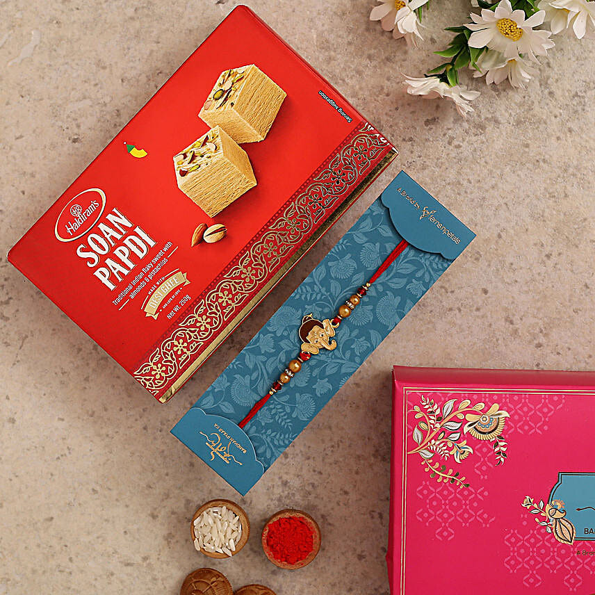 Long Trunk Bal Ganesha Pearl Rakhi For Kids With 250 Gms Soan Papdi