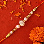 Elegant Pearl And Mauli Rakhi With 250 Gms Soan Papdi