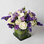 Fascinating White Roses & Purple Statice Flowers Glass Vase