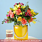 Yellow Jar Of Vibrant Flowers & Designer Rakhi