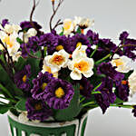 Purple & White Artificial Flowers In Green Pot
