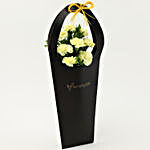 8 Yellow Carnations in Black FNP Sleeve Bag