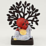 Monk Idol Sitting Under A Tree
