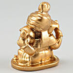 Golden Ganesha Idol & Chocolates In Fancy Potli