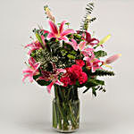 Gorgeous Flowers In Cylindrical Vase