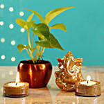 Beige Ganesha Idol & Candles With Money Plant