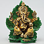 Divine Raja Ganesha Idol On Green Leaf Throne