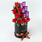 Red Roses & Dairy Milk Arrangement In Round FNP Box