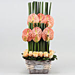 Pink Anthurium & Peach Roses Arrangement In Cane Basket