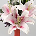 Pink Oriental Lilies In Peach Glass Vase