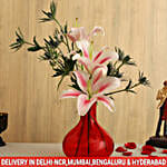 Buy/Send Pink Oriental Lilies In Red Glass Vase Online- FNP
