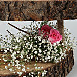 Mixed Flowers On Wooden Log