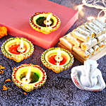 4 Colourful Diyas & Ganesha Idol With Kaju Roll