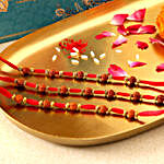 Sneh Golden Beads & Rudraksha Rakhi Set With Fabelle Assorted Chocolates