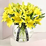 Cheerful Yellow Lilies In Fishbowl Vase