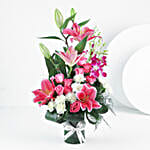 Elegant Mixed Flowers In Cylindrical Vase