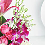 Elegant Mixed Flowers In Cylindrical Vase