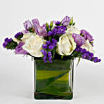 Fascinating White Roses & Purple Statice Flowers Glass Vase