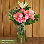 Mixed Flowers In Cylindrical Vase