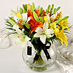 Mix Of Lilies In Fishbowl Vase