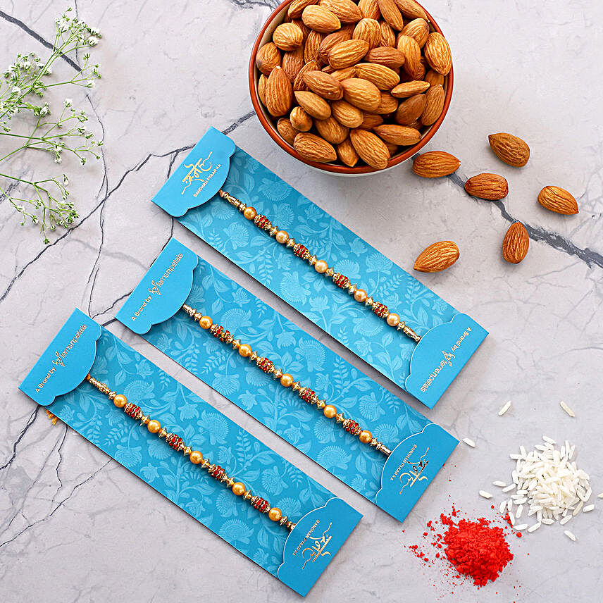 Traditional Pearl Studded Rakhi Trio And Healthy Almonds