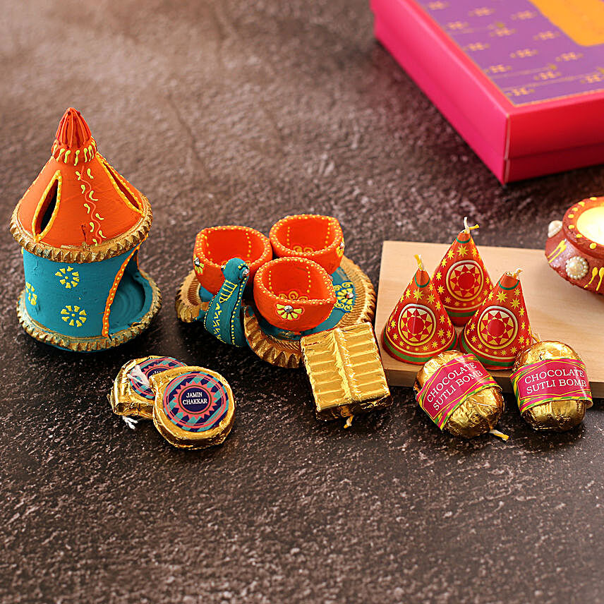 Two Diyas With Cracker Shaped Chocolates
