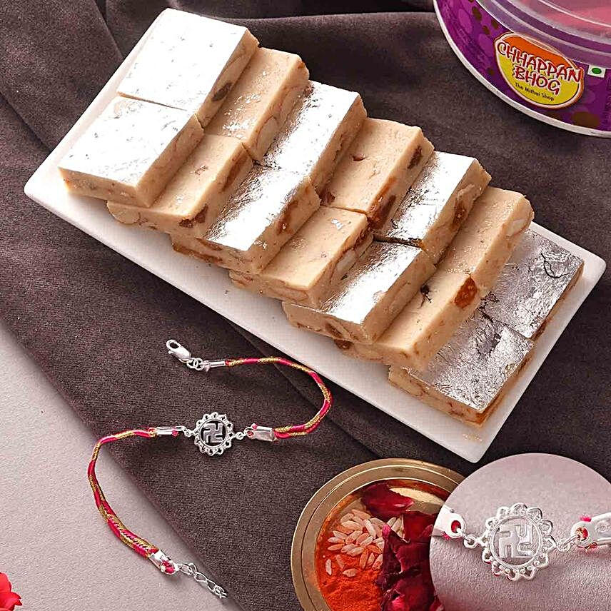 Designer Swastik Silver Rakhi And Kaju Anjeer Burfi:Rakhi with Sweets to Saudi Arabia