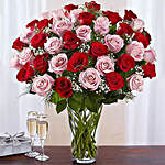 50 Red And Pink Roses In A Glass Vase