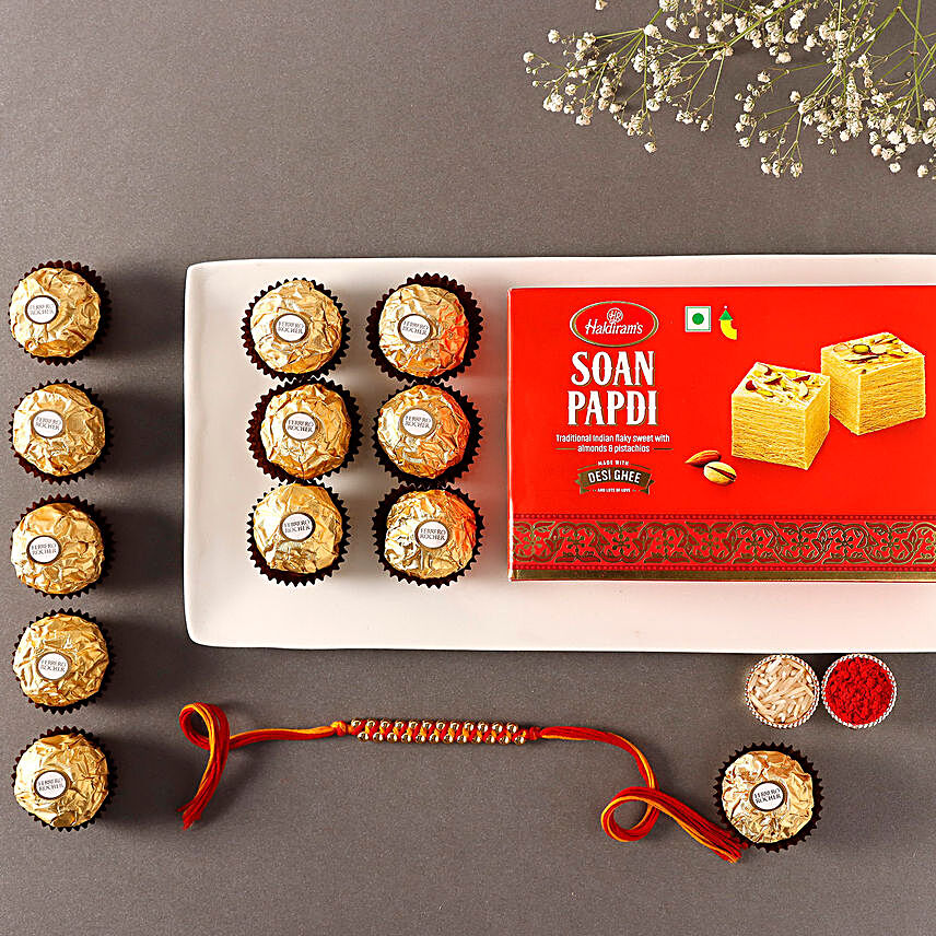 Sneh Elegant Gold Rakhi with Soan Papdi & Ferrero Rocher:Single Rakhi to Singapore
