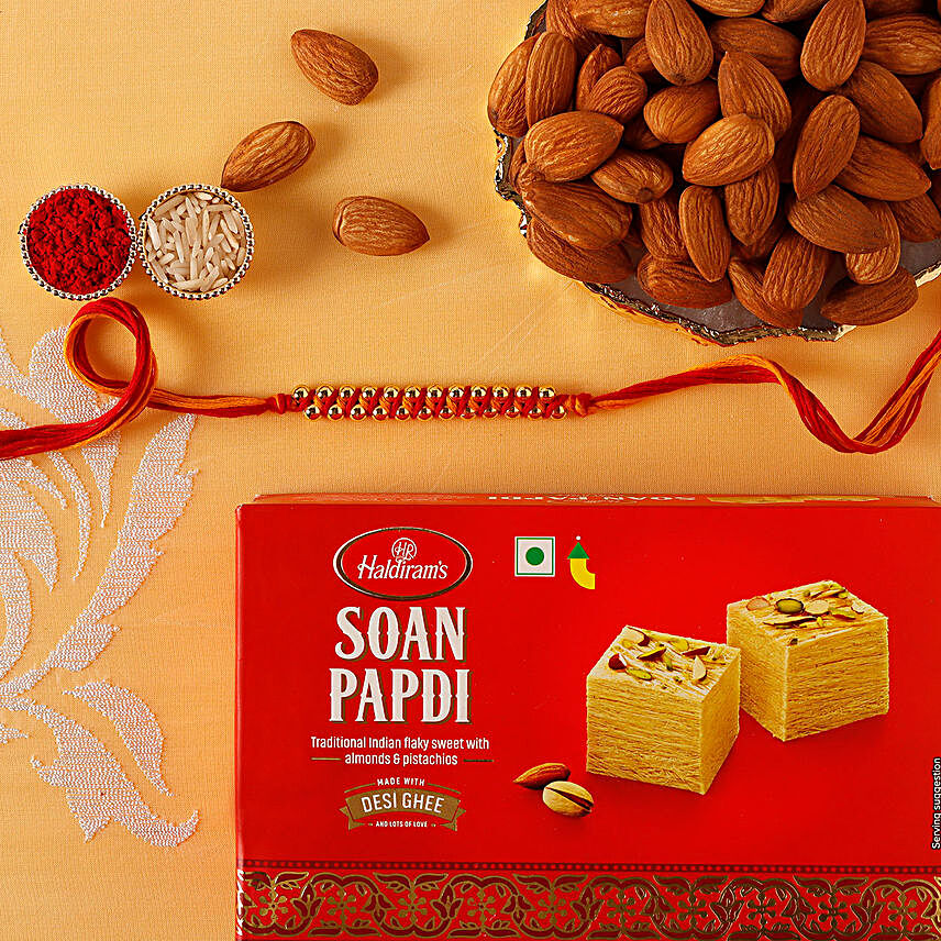 Sneh Elegant Gold Rakhi with Soan Papdi:Single Rakhi to Singapore