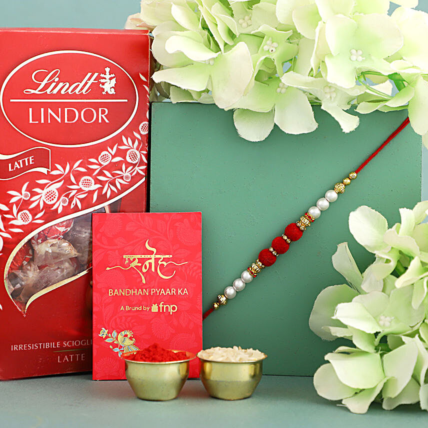 Sneh Red White Pearl Rakhi & Lindor Chocolate