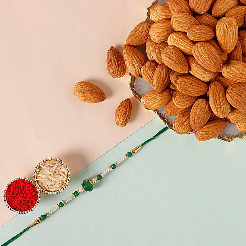 Sneh Fancy Green Rakhi & Almonds:Pearl Rakhi to Singapore