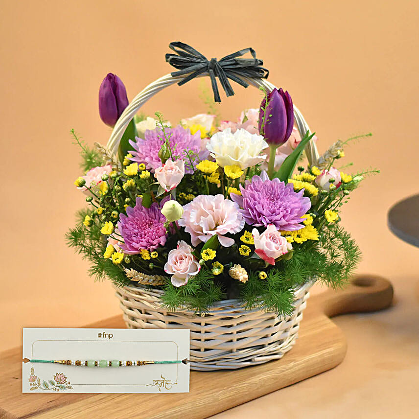 Striking Mixed Flowers Round Basket With Green Pearl Rakhi