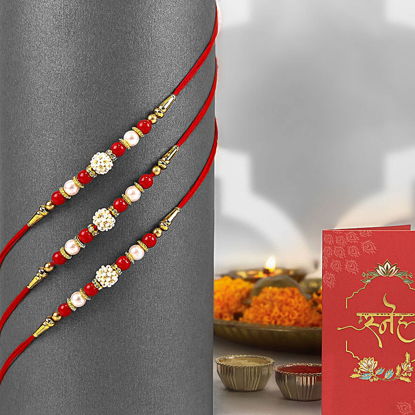 Timeless Pearl Rakhi Set of 3 N Laddoo Combo