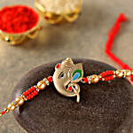 Alluring Rose Gold Ganesha Rakhi With Kaju Katli