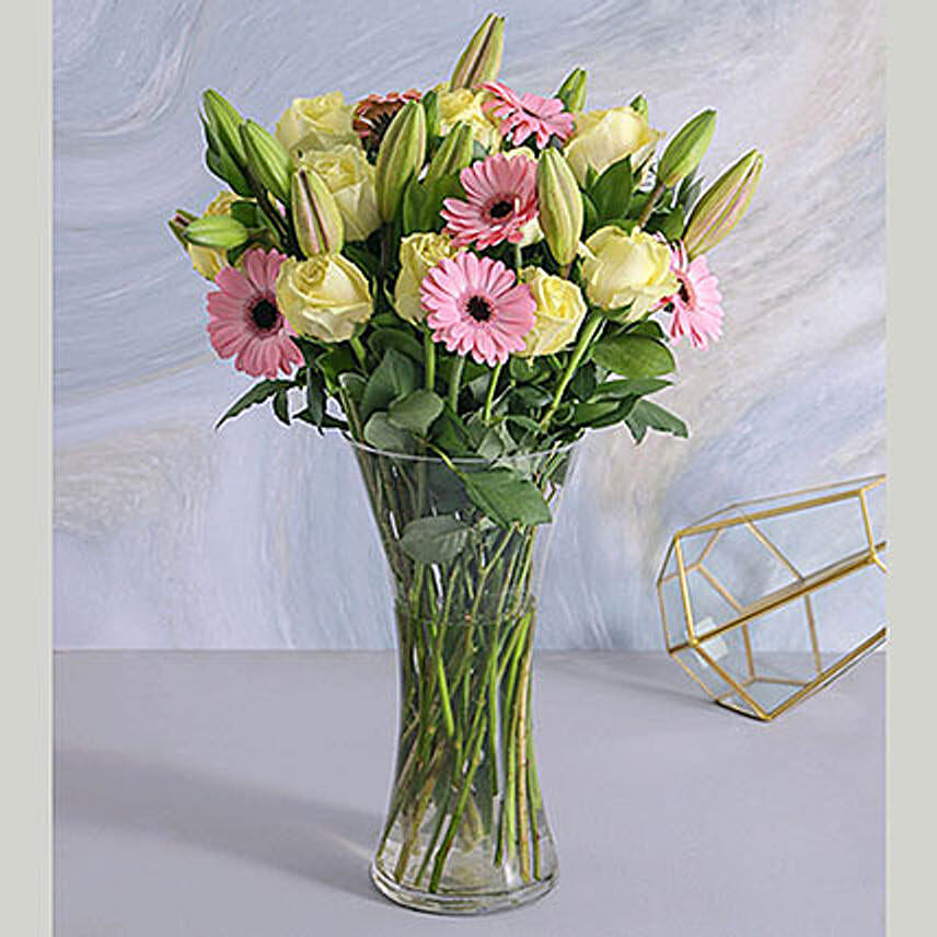 Pastel Seasonal Flowers In A Glass Vase