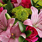 Pretty In Pink Lilies And Cerise Roses In A Vase